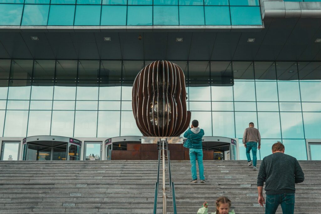 a group of people walking up some steps